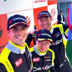 Zak and team get the bubbly out on the podium